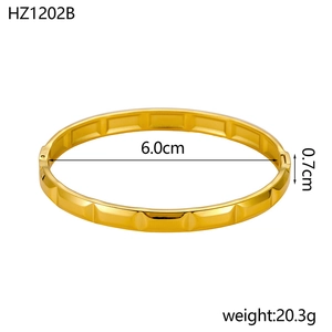 Detailed view of 18K gold plated stainless steel cuff with geometric pattern and dimensions