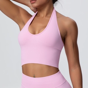 Seamless ribbed halter neck sports bra and leggings set in baby pink for yoga fitness
