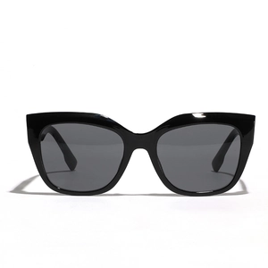 Classic black oversized cat-eye sunglasses with dark grey lenses in a minimalist trendy style