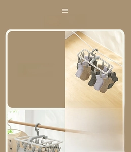 Detail view of foldable clothes drying rack showing 12 and 20 clip options in light grey