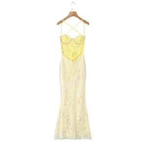 Detailed back view of a yellow mermaid dress featuring 3D floral lace and lace-up straps