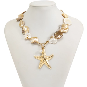 Close-up of golden starfish pendant with irregular natural shell beads and pearl