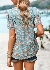 Macro view of floral print top with lace stitching and square neck back design