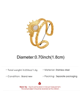 Detail view of double-layer stainless steel ring with sunburst and white gemstone inlay