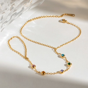 Gold stainless steel finger bracelet with five colorful round cubic zirconia stones
