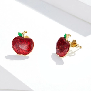 Detail showing S925 sterling silver stamp on golden apple studs with red glitter finish