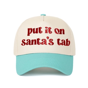 Close-up of red 'put it on santa's tab' 3D embroidery on two-tone baseball cap