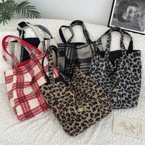 Detailed collection of four plush shearling tote bags in plaid and leopard patterns