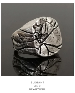 Macro shot of vintage style ring with cracked texture and antique silver finish