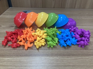 Rainbow counting dinosaurs with sorting bowls for early childhood color recognition