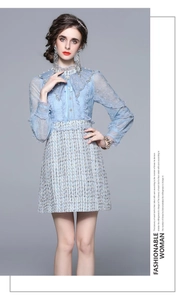 Detail of blue lace top with ruffled collar and beaded embroidery on tweed dress