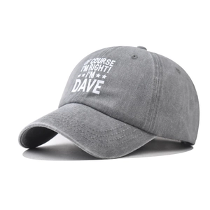 Side view of washed grey cotton baseball cap with white embroidered slogan and curved brim
