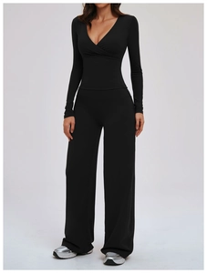 Front view of black V-neck wrap yoga top and high-waist wide-leg pants sports set