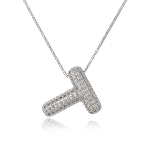 Detail of silver T-letter pendant encrusted with pavé zircons and a matching box chain