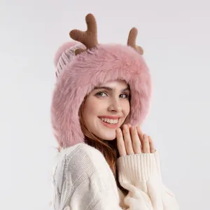 Pink plush reindeer knit hat with brown antlers and faux fur earflaps for winter warmth