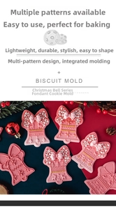 Detail of pink Christmas bell cookie molds with reindeer and snowflake relief patterns