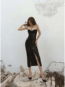 Detailed view of black sequin halter dress featuring a slim fit and high side slit design