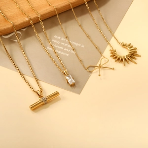 Set of minimalist gold plated stainless steel necklaces with geometric crystal pendants