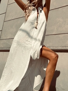 Elegant white sleeveless button-down cotton shirt dress with a stylish side slit design