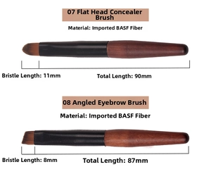 Detail of concealer and eyebrow brushes with synthetic hair and wooden handles