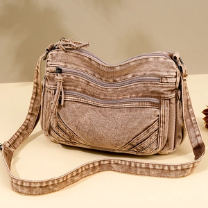 Vintage crossbody bag in brown washed denim with multi-layer zipper and adjustable strap