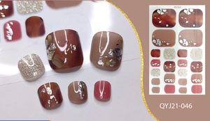 Detail of red-brown toe nail stickers with marble patterns and silver foil flakes