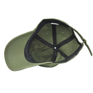 Detail view of cotton baseball cap interior with sweatband, wash label and metal strap buckle