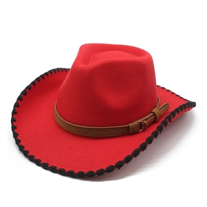 Red wool cowboy hat with black stitched brim and brown leather band on white background