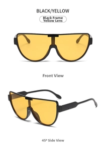 Front and 45-degree views of oversized black aviator sunglasses with yellow lenses