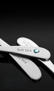 Macro detail of the 304 stainless steel handle with SUS 304 engraved markings