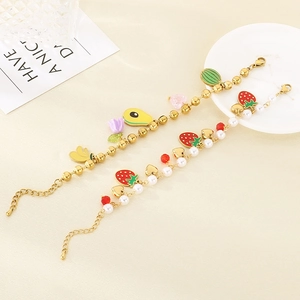 Gold stainless steel fruit charm bracelet with colorful enamel strawberry and pearl accents