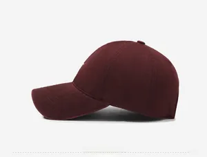 Detail of wine red cotton baseball cap featuring high-quality side letter embroidery
