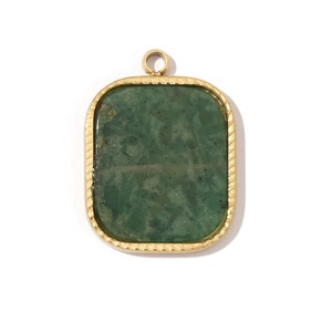 Macro shot of rectangular green stone pendant with gold titanium steel frame on white background