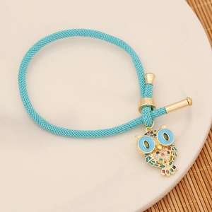 Blue woven natural stone pearl bracelet with golden owl charm and colorful gemstones