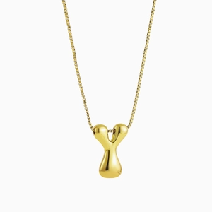 Macro shot of 18K gold plated puffy letter Y pendant with a polished box chain