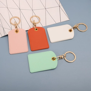 Pastel PU leather rectangular keychains in pink, orange, white, and mint green