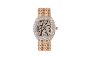 Detail of rose gold tonneau watch face with encrusted rhinestones and art deco numerals