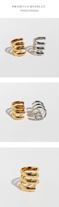 Detail view of bamboo texture on multi-layer spiral rings in gold and silver finish