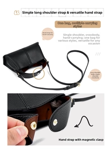 Detail view of black pebble leather handbag with magnetic closure and long shoulder strap