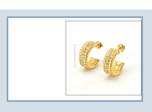 Detail view of 21mm 18K gold plated stainless steel C-shaped earrings with triple row zircon
