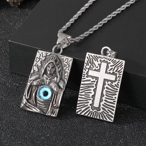 Gothic silver evil eye pendant with cross and reaper details on a twisted chain necklace