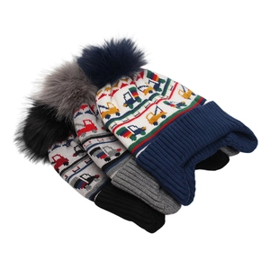 Winter knit hats for boys featuring colorful jacquard trucks and soft faux fur pom-poms