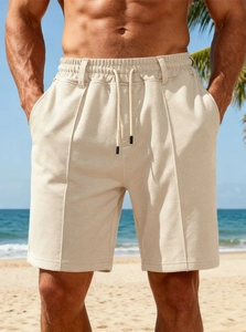 Detail of men's beige quick-dry shorts with drawstring waist and waffle knit texture