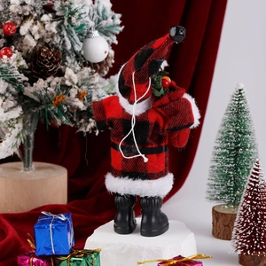 Detail view of standing Santa Claus doll in red plaid outfit with festive gift bag