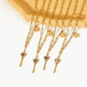 Elegant 18K gold plated paperclip chain with heart key and lock charms in four colors