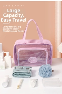 Close-up of pink large capacity travel toiletry bag with transparent PVC window and handles