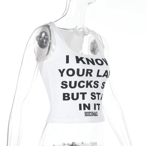 Close-up of white ribbed knit tank top featuring black letter printing and slim fit