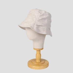 Breathable beige linen bucket hat for women with pleated design and minimalist style