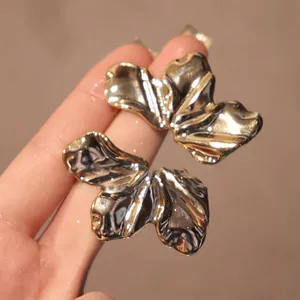 Chic abstract acrylic wrinkled leaf earrings in metallic gold finish for women