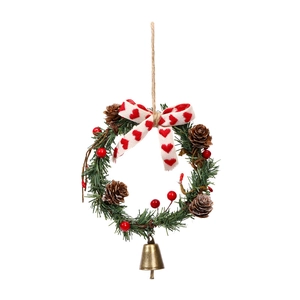 Christmas wreath with pine needles, red berries, cones, bow, and vintage metal bell